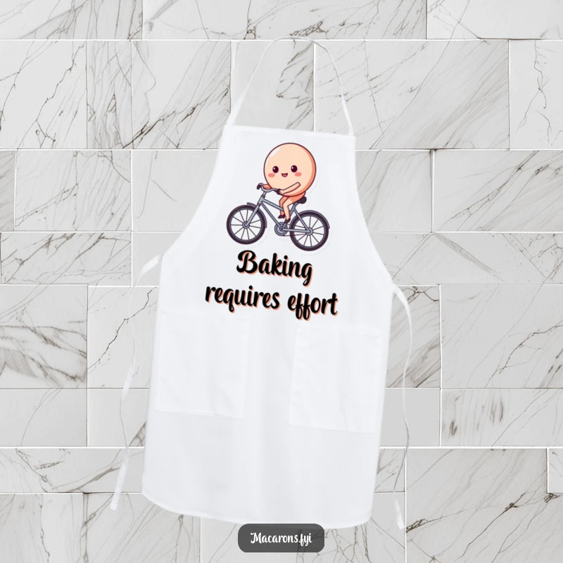 Funny macaron character on a tiny bicycle, pedaling with a determined and happy face, featured on this durable and humorous kitchen apron.