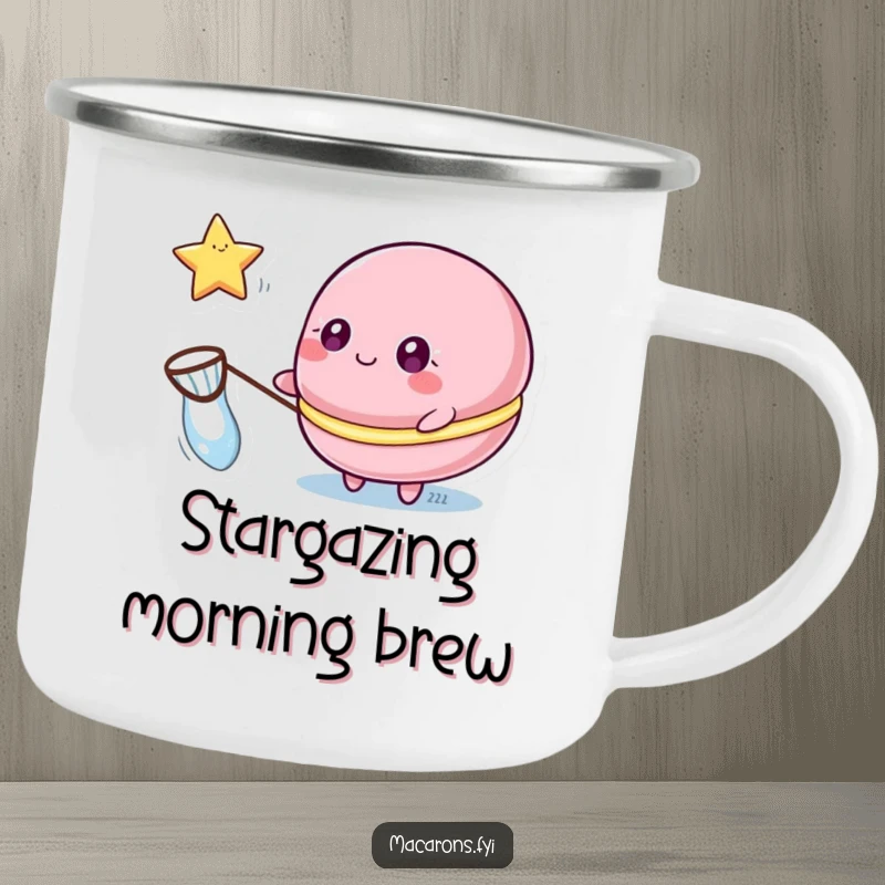 Funny macaron camping mug showing a macaron character with sparkling eyes catching a floating star with a net, for starry outdoor moments.
