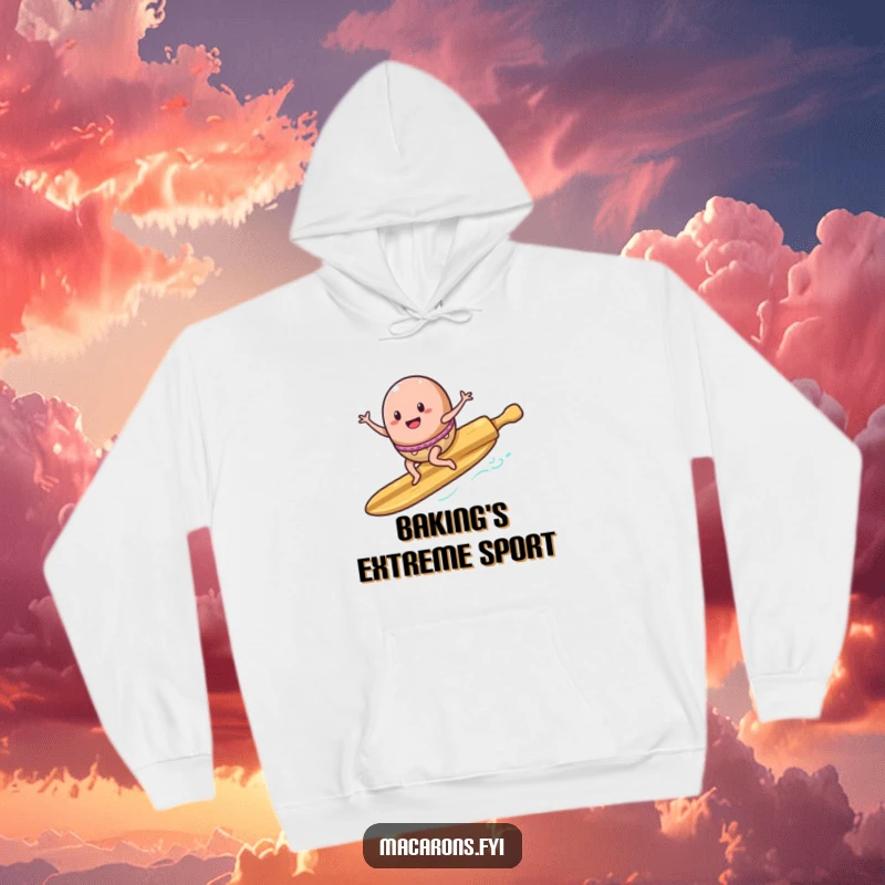 Funny Hoodie: An energetic macaron character is shown riding a rolling pin as if it were a surfboard, catching a wave.