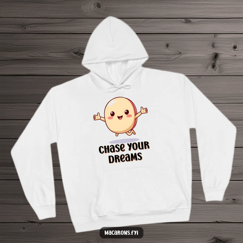 Funny macaron character running with open arms, featured on a cozy hoodie, symbolizing happiness and movement.