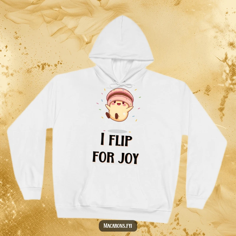Funny macaron character in mid-cartwheel, surrounded by flying sprinkles, offering a blend of warmth and humor on a soft hoodie.