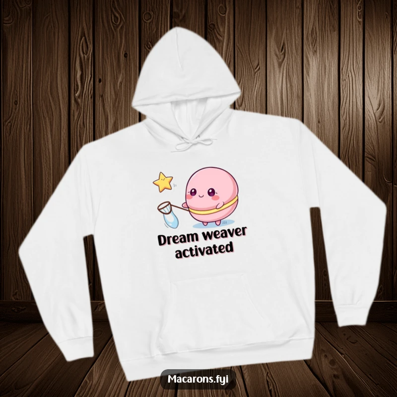 Funny macaron hoodie showcasing a macaron character with sparkling eyes catching a floating star with a net.