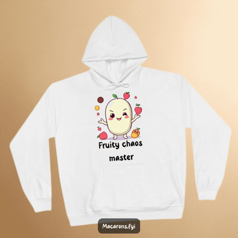 Funny Hoodie: A mischievous macaron character grins broadly while expertly juggling tiny fruits, showcasing its playful talent.