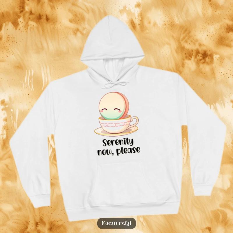 Funny Macaron Hoodie featuring a serene macaron floating peacefully on a teacup, embodying tranquility.