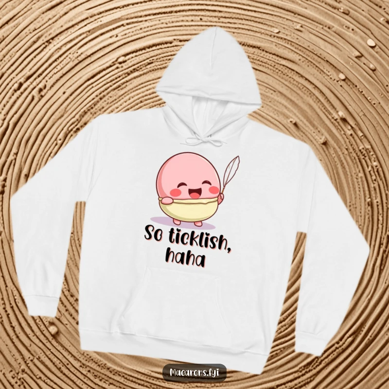 Funny Kawaii macaron character laughing hysterically from a feather tickle, on this warm and humorous hoodie.
