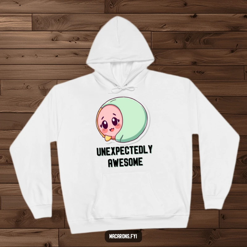 Funny macaron character tumbling with surprised delight, depicted on a cozy hoodie for comforting fun.