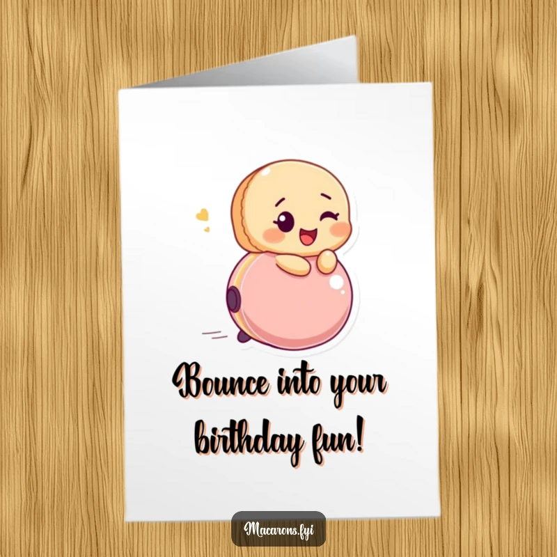 Funny Free Printable Birthday Card: Glee-filled macaron winks while riding a bouncing ball, celebrating. A downloadable burst of joy.