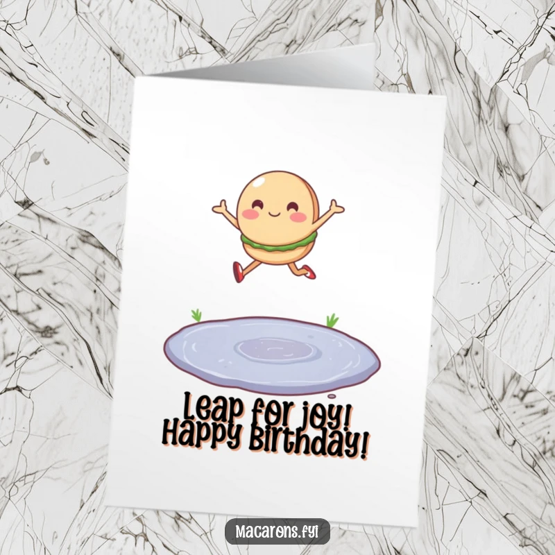 Funny Free Printable Birthday Card: A single macaron character joyfully leaps over a tiny puddle.