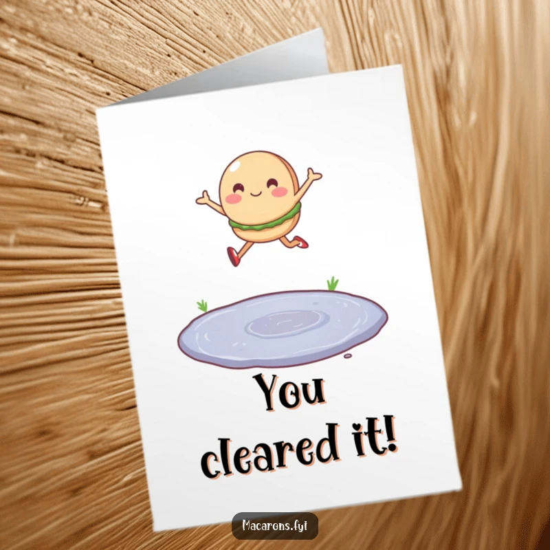 Free Printable Congratulations Card: A happy macaron character leaping joyfully over a small puddle.