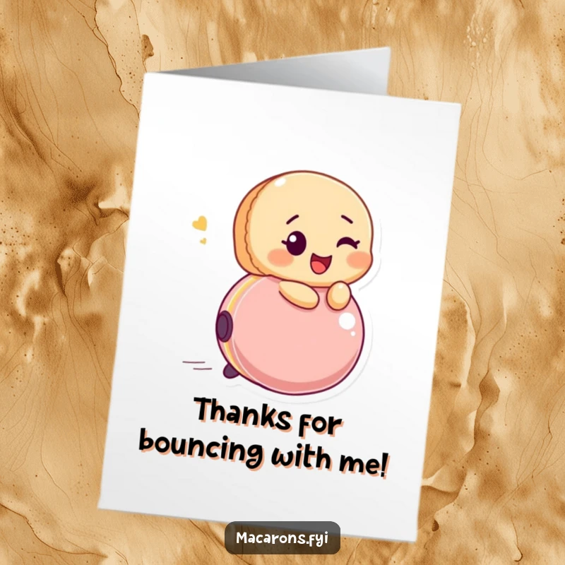 Funny Free Printable Thank You Card: Winking macaron happily riding a bouncing ball, expressing fun gratitude. A downloadable delight.