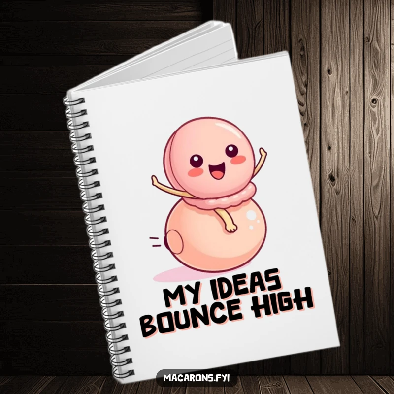 Funny peppy macaron character energetically riding a small bouncy ball, adorning a notebook for capturing exciting ideas and plans.