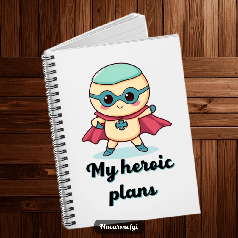 Funny superhero macaron notebook featuring a macaron in a dramatic pose with flowing capes, ideal for note-taking.