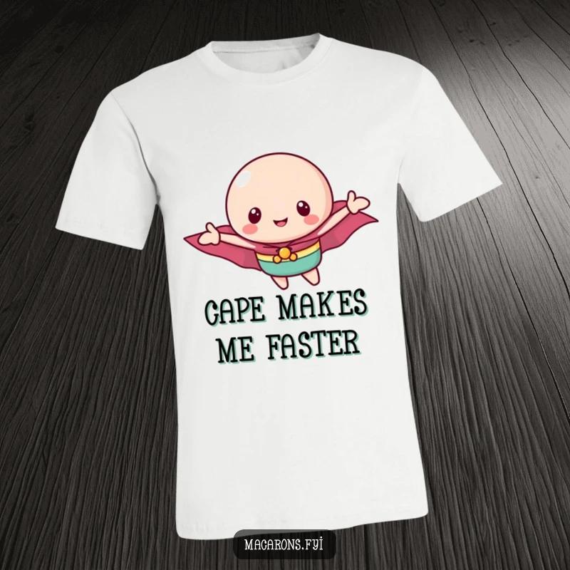 Funny macaron t-shirt depicting a brave little macaron with a tiny cape soaring through the sky with joyful abandon.