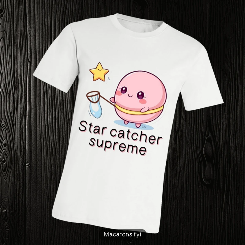Funny macaron t-shirt depicting a macaron character with sparkling eyes catching a floating star with a small net.
