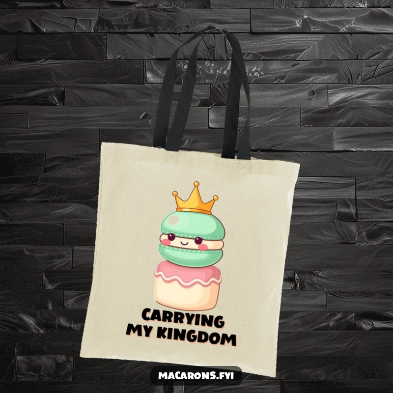 Funny macaron character wearing a small crown, looking regal atop a tiny cake, on a sophisticated tote bag.