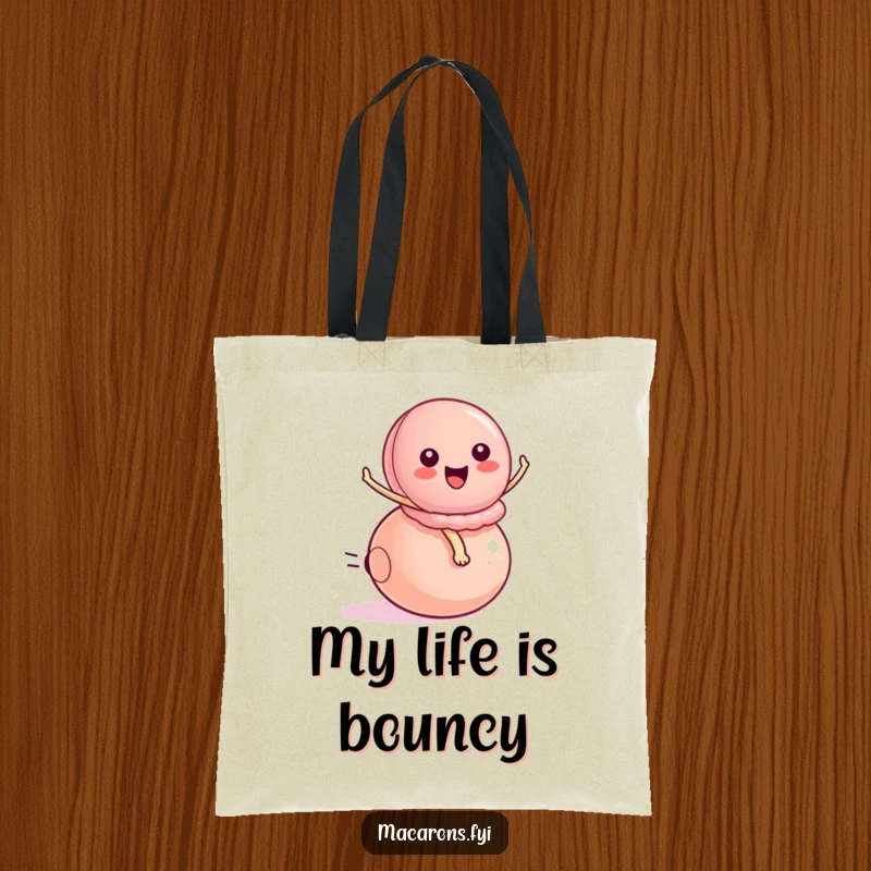 Funny peppy macaron character energetically riding a small bouncy ball, printed on a durable tote bag for fun, active use.